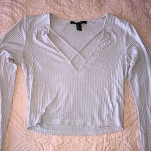 A long sleeve, light purple v cut line shirt